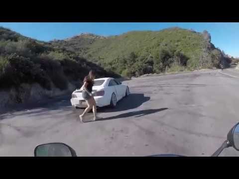 Extremely Close Call For Motorcyclist As On-Coming Car Spins Out of Control