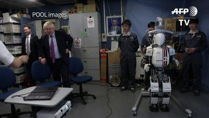 Britain's Johnson meets high-tech robots in Japan