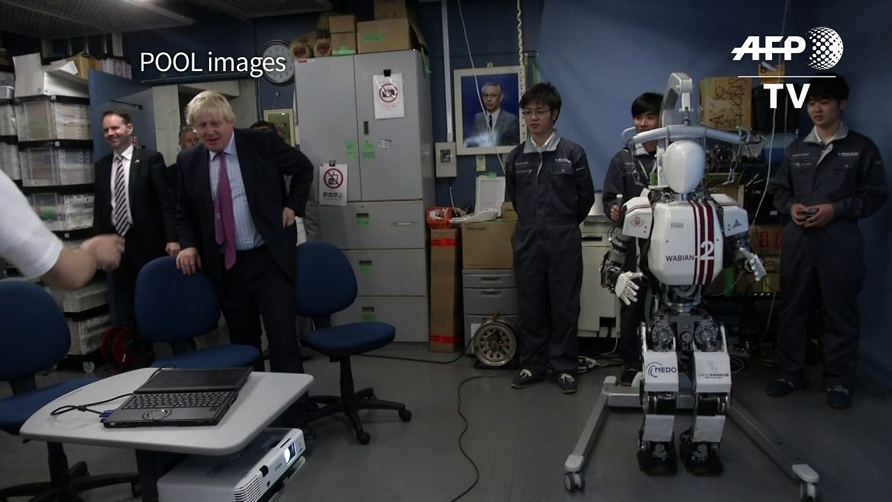 Britain's Johnson meets high-tech robots in Japan