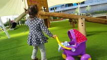 Little Girl Pushing Peppa Pig Stroller / Playground / Having Fun with Baby Doll