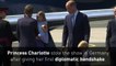 Little Princess Charlotte given tiny bouquet of flowers, does first diplomatic handshake