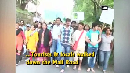 Tourists, locals take out foot march to preserve Naini Lake