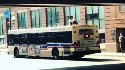 Chicago man spotted catching a ride on top of a bus 'like a boss'