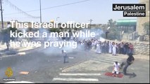 This Israeli officer kicked a man while he was praying outside the al-Aqsa Mosque compound