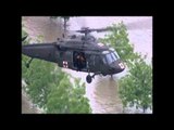 pilot saving two men drowning into flood from helicopter