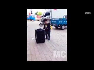 Funny Boy is Dancing on the street.