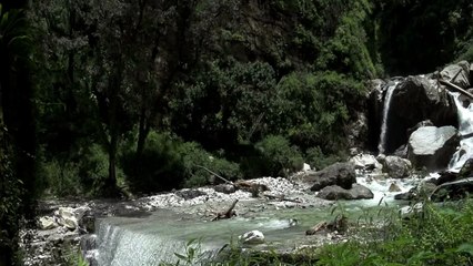 Crossing a raging Himalayan torrent by car- monsoon in the mountains