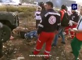 Israeli Forces run over a Palestinian youth and when medics approach to help the injured youth, the border police officer pepper sprays them..