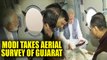 Gujarat floods: PM Modi takes aerial survey, announces relief of Rs 500 cr | Oneindia News