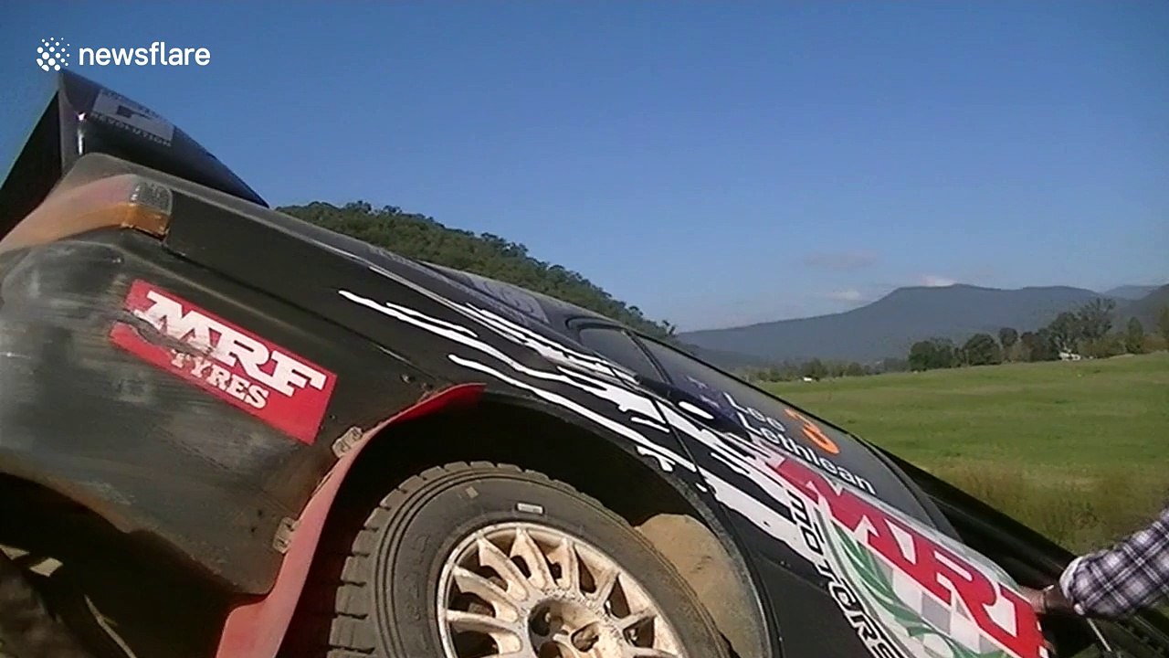 Rally spectator runs for his life as car crashes into barrier