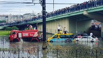 Firefighters Rescue People Trapped Atop Cars in Flooded Western Istanbul