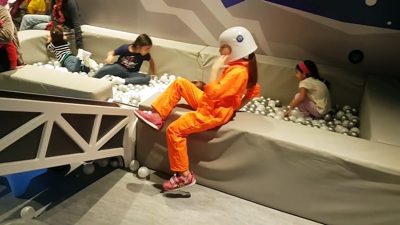 Indoor playground for kids in space.  Playing in spacecraft. Funny  video