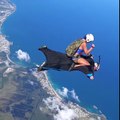 Skydiver Riding on the Wingsuit Pilot