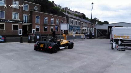 Sports car driver can drive under car park barrier