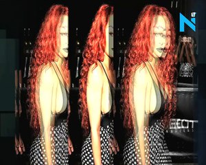 New man, new hair! Blac Chyna debuts tumbling red tresses as she flaunts major sideboob in a plunging jumpsuit... after being linked to rapper Mechie