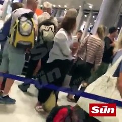 Airport worker caught on video punching passenger who’s holding an infant