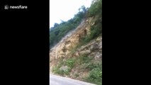 Huge landslide blocks road, trapping tourists