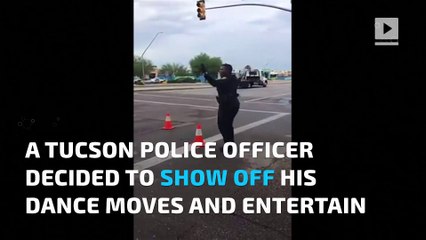 Dancing police officer stops traffic with killer moves