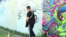 Berlin activists turn Nazi hate graffiti into art