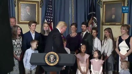 Child in wheelchair reaches up twice to shake the Presients Trump's hand - gets ignored