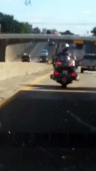 Motorcyclist Jamming Out on the Highway