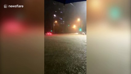 Cars submerged in Beijing flash flood