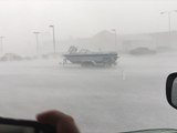 VIDEO: Strong winds push boat across parking lot