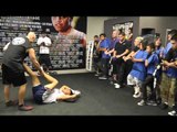 Victor Ortiz in the gym stretching before Workout