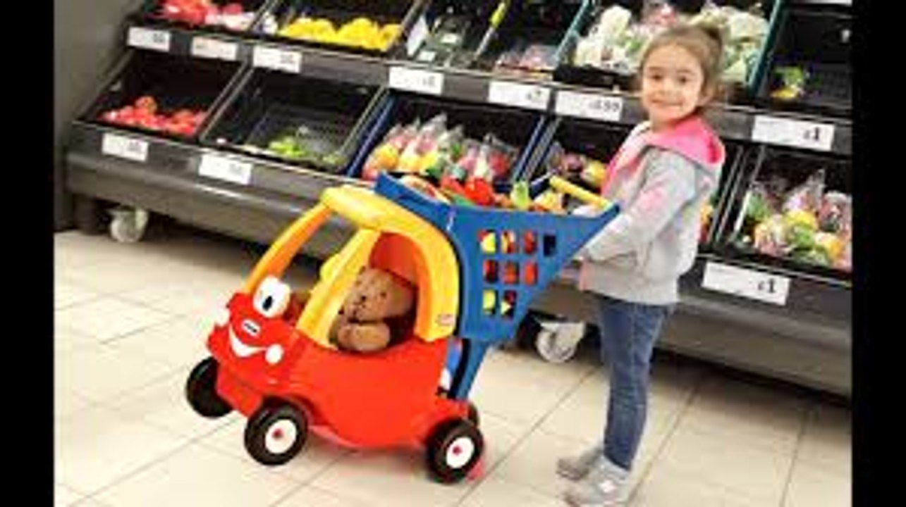 Little girl Doing Shopping  - Kids Size Cozy Coupe Shopping Cart- Nursery Rhymes