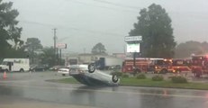 Severe Thunderstorm Flips Over Cars In Front of Strip Mall