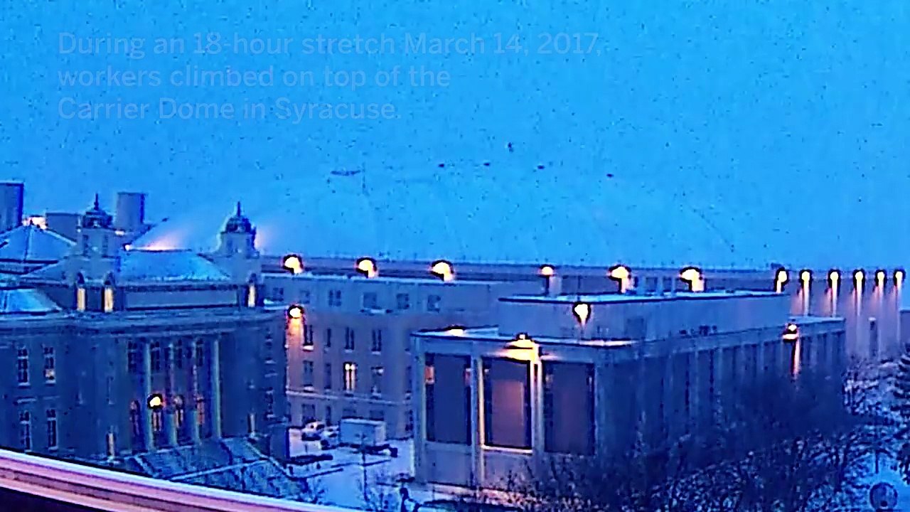 Time lapse of workers clearing snow from Carrier Dome roof in Syracuse
