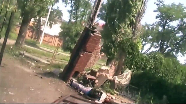 Убитые и раненые наемники после обстрела ВСУ базы бригады Заря в оккупированном Луганске 11 июля 2014-го.