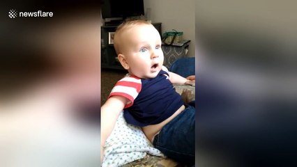 Baby has adorable reaction to dad shaving his beard