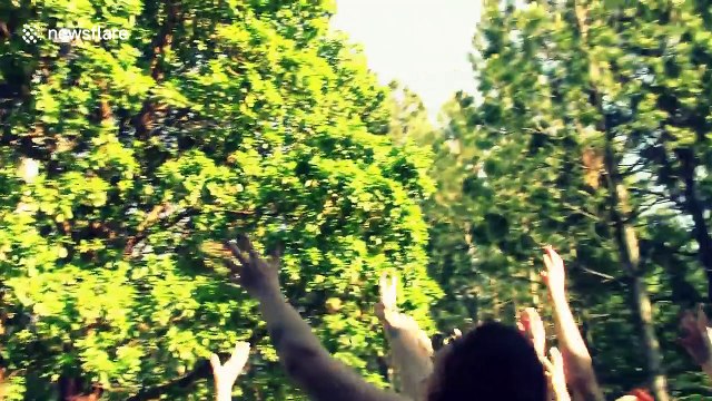 Bride tosses bouquet with catapult