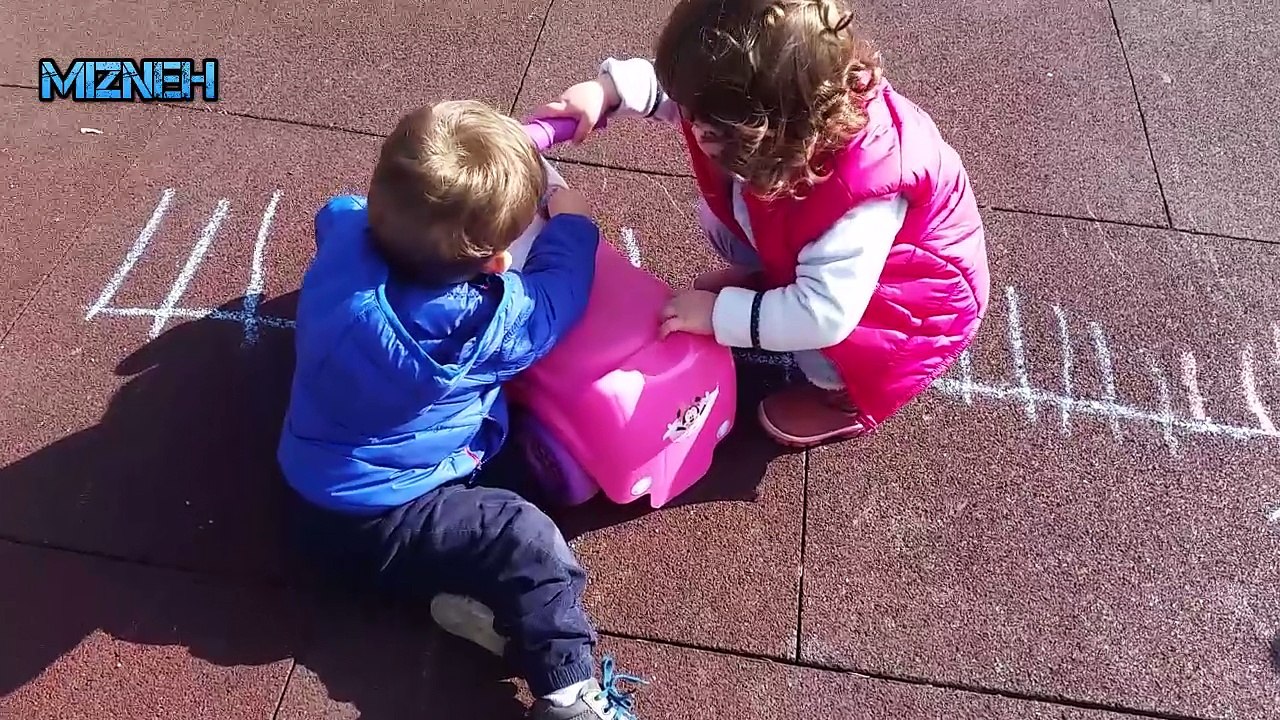 Children sharing toys at the playground