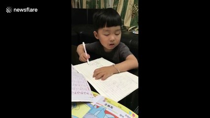 Cute kid falls asleep while doing homework