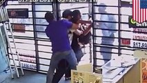 Video shows two store clerks fight off two gun-wielding robbers
