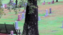 Family Burying Loved One Sees Protruding Foot From Adjacent Plot Resting On The Casket