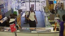 Camera captures store clerks fighting off armed robbers