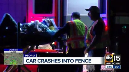 Car crashes into fence in Peoria