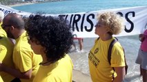 Barcelona residents protest on the beach against tourists