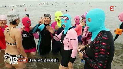 Chine: Sur la plage, de nombreuses personnes mettent sur leur visage une cagoule - Découvrez pourquoi ! - VIDEO