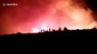 Spectacular video shows firefighters battling blaze near Athens, Greece