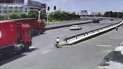 Terrifying moment boy almost gets run over by lorry