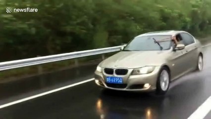 Police in China pull over man wiping windsceen by hand