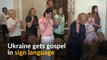 In Ukraine, priest delivers sermon in sign language