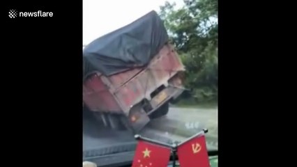 Two vehicles get stuck in bizarre position after collision