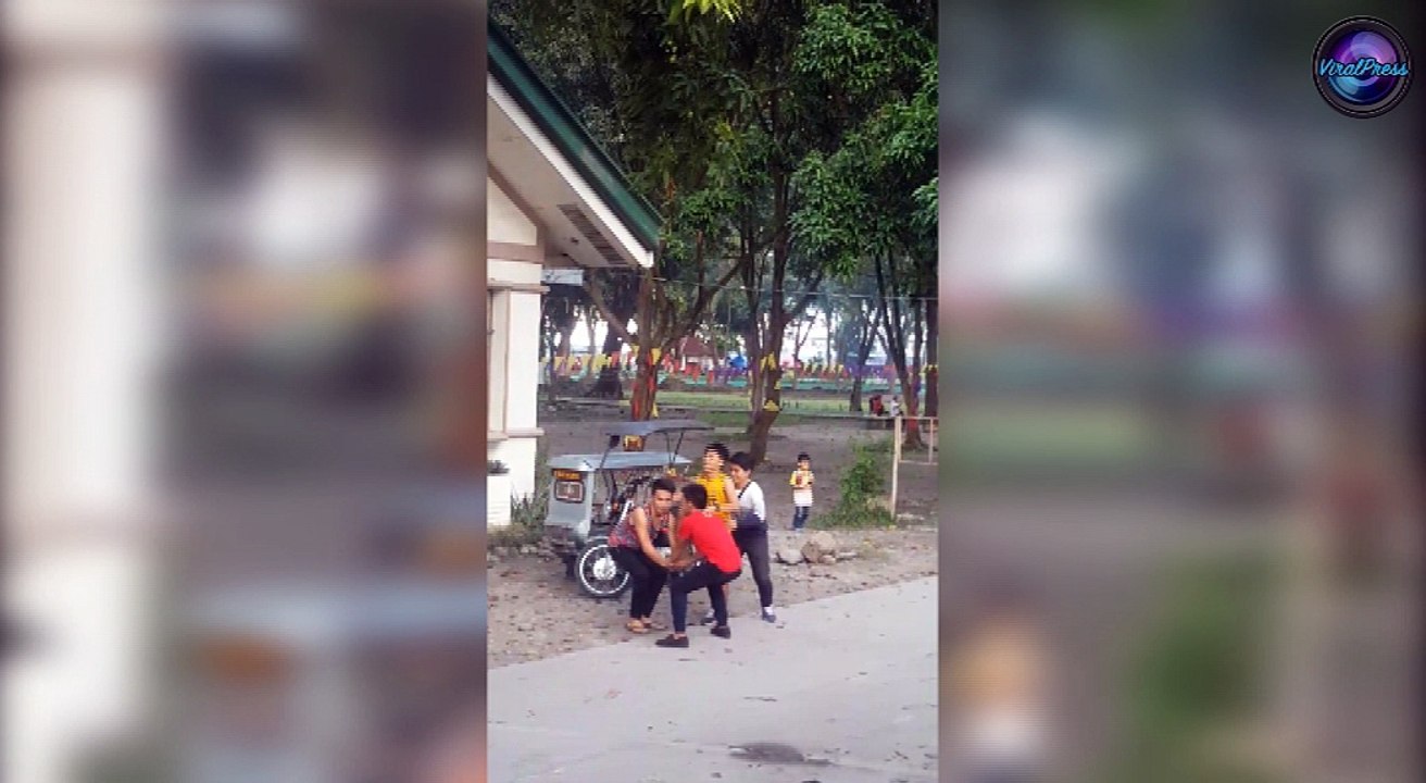 Students Get Mango Down From Tree In The Philippines