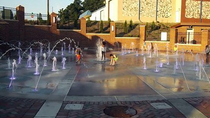 Super Hero Kids Playing In The Water Park