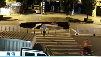 Sinkhole swallows up man on motorbike in China